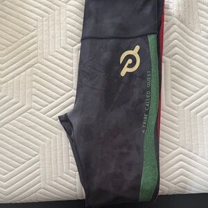 Peloton Black Leggings with Gold Logo and Green Stripe